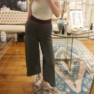 Grey pants with a red and blue stripe